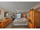 Cozy bedroom with wood furnishings and ceiling fan, providing a relaxing space at 601 Cedar Grove Dr, Brandon, FL 33511