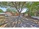 Charming single-story home with a well-maintained lawn and mature trees creating a shaded landscape at 601 Cedar Grove Dr, Brandon, FL 33511