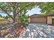 This single-story home has an attached two-car garage and a well-manicured garden bed at 601 Cedar Grove Dr, Brandon, FL 33511