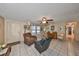 Comfortable living room featuring a piano, tile flooring, and natural light at 601 Cedar Grove Dr, Brandon, FL 33511