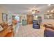 Open-concept living room and dining area with tile floors and comfortable seating at 601 Cedar Grove Dr, Brandon, FL 33511
