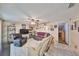 Open-concept living space with tile floors, a ceiling fan, and neutral wall paint for an inviting atmosphere at 601 Cedar Grove Dr, Brandon, FL 33511