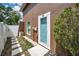 Exterior shot of the home highlighting the private backyard and door to enter the home at 613 Valley Hill Dr, Brandon, FL 33510