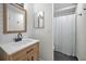 Modern bathroom with subway tile, a wood vanity, and a shower with a white curtain at 613 Valley Hill Dr, Brandon, FL 33510