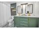 Bathroom featuring double sinks, elegant mirrors, and modern fixtures with a decorative wall at 613 Valley Hill Dr, Brandon, FL 33510