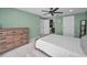 Spacious bedroom boasts natural light, ceiling fan, and stylish green walls at 613 Valley Hill Dr, Brandon, FL 33510
