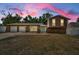 Well-maintained home with a three-car garage and a welcoming light-blue front door at 613 Valley Hill Dr, Brandon, FL 33510