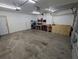 Spacious garage with ample workspace and overhead storage at 613 Valley Hill Dr, Brandon, FL 33510