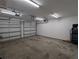 Well-lit garage with two doors, ample storage and workspace at 613 Valley Hill Dr, Brandon, FL 33510