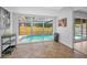 Kitchen with large windows providing natural light and a view of the pool at 613 Valley Hill Dr, Brandon, FL 33510