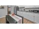 Updated kitchen featuring white cabinets, stainless steel appliances, and modern countertops at 613 Valley Hill Dr, Brandon, FL 33510