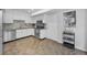Updated kitchen featuring white cabinets, stainless steel appliances, and neutral backsplash at 613 Valley Hill Dr, Brandon, FL 33510