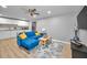 Open living room and kitchen with modern lighting, hardwood floors, and contemporary design at 613 Valley Hill Dr, Brandon, FL 33510