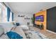 Bright living room featuring modern decor, hardwood floors, and a stylish entertainment center at 613 Valley Hill Dr, Brandon, FL 33510