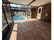 Spacious screened-in patio with access to the pool and views of the backyard at 613 Valley Hill Dr, Brandon, FL 33510
