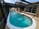 In-ground pool in screened-in enclosure with a patio outside of the home at 613 Valley Hill Dr, Brandon, FL 33510