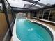 Screened pool area featuring an in-ground pool with patio and a fountain at 613 Valley Hill Dr, Brandon, FL 33510