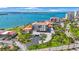 Aerial view of condo community located right on the water with a bridge nearby and a parking area available at 6357 Bahia Del Mar Blvd # 111, St Petersburg, FL 33715