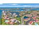 Stunning aerial view of a waterfront community boasting multiple swimming pools, boat docks, and lush green landscaping at 6357 Bahia Del Mar Blvd # 111, St Petersburg, FL 33715
