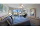 Tranquil bedroom featuring comfortable bedding, soft lighting, and serene outdoor views at 6357 Bahia Del Mar Blvd # 111, St Petersburg, FL 33715