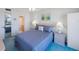 Inviting bedroom with a peek to an attached bathroom, providing comfort and convenience at 6357 Bahia Del Mar Blvd # 111, St Petersburg, FL 33715