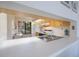 Practical kitchen showcasing light wood cabinets, a pass-through, and essential appliances at 6357 Bahia Del Mar Blvd # 111, St Petersburg, FL 33715