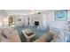 Inviting living room featuring comfortable seating and a dining area with plenty of natural light at 6357 Bahia Del Mar Blvd # 111, St Petersburg, FL 33715