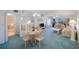 Open-concept living area with dining space, living room, and adjacent bathroom at 6357 Bahia Del Mar Blvd # 111, St Petersburg, FL 33715