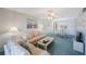 Comfortable living room with neutral tones and a dining area creating a cozy and inviting space at 6357 Bahia Del Mar Blvd # 111, St Petersburg, FL 33715