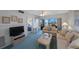 Relaxing living room with cozy furnishings and a peek into the bedroom, offering a glimpse of comfort at 6357 Bahia Del Mar Blvd # 111, St Petersburg, FL 33715