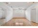 Bedroom featuring light hardwood floors, natural light, and a large closet for ample storage at 7039 Woodibis Dr, New Port Richey, FL 34654