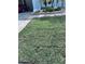 Lush, green front yard with landscaped elements adds curb appeal to this home at 7039 Woodibis Dr, New Port Richey, FL 34654
