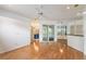 Bright living room featuring wood floors, ceiling fan, recessed lighting, and glass sliding door to the lanai at 7039 Woodibis Dr, New Port Richey, FL 34654