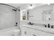 Bright bathroom features marble tile, double sinks, and modern fixtures for a clean aesthetic at 7113 S Kissimmee St, Tampa, FL 33616