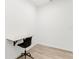 Bedroom with a light wood floor, a desk, and a black office chair at 7113 S Kissimmee St, Tampa, FL 33616