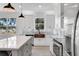 Beautiful gourmet kitchen with custom cabinets, stainless appliances and custom copper sink at 7113 S Kissimmee St, Tampa, FL 33616
