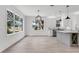 Large open concept kitchen and dining area with lots of natural light and open floor plan at 7113 S Kissimmee St, Tampa, FL 33616