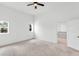Main bedroom with two windows and a door leading to closet area at 7113 S Kissimmee St, Tampa, FL 33616