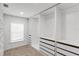 Walk-in closet featuring custom storage options and a window at 7113 S Kissimmee St, Tampa, FL 33616