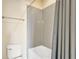 Bathroom with tub and shower featuring grey subway tiles and shower curtain at 7502 Sea Lilly Ct, Apollo Beach, FL 33572