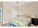 Well-lit bedroom with view of the closet doors and a nightstand at 7502 Sea Lilly Ct, Apollo Beach, FL 33572