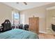 View of the bedroom with a window, wardrobe, and doorway to the bathroom at 7502 Sea Lilly Ct, Apollo Beach, FL 33572