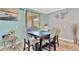 Cozy dining area with stylish decor and access to the outdoor patio at 7502 Sea Lilly Ct, Apollo Beach, FL 33572