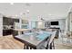 Open concept dining area featuring a wooden table set and natural light, great for Gathering meals at 7502 Sea Lilly Ct, Apollo Beach, FL 33572
