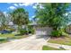 Beautiful home showcasing a well-maintained lawn, lush landscaping, and a two-car garage at 7502 Sea Lilly Ct, Apollo Beach, FL 33572