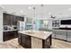 Kitchen island with stainless steel appliances and granite countertops offers modern convenience and style at 7502 Sea Lilly Ct, Apollo Beach, FL 33572