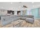 An expansive living room featuring light, airy walls and light wood-look floors at 7502 Sea Lilly Ct, Apollo Beach, FL 33572