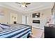 This main bedroom has a tray ceiling and a view to the ensuite bathroom at 7502 Sea Lilly Ct, Apollo Beach, FL 33572