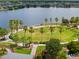 Picturesque aerial view of a park with a lake, lush green spaces, and walking paths at 7502 Sea Lilly Ct, Apollo Beach, FL 33572