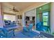 Relaxing covered patio featuring ceiling fan, comfortable seating and an indoor/outdoor living vibe at 7502 Sea Lilly Ct, Apollo Beach, FL 33572